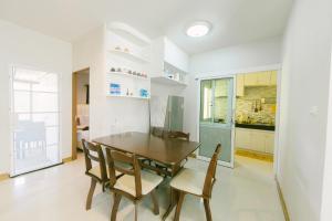 a kitchen and dining room with a table and chairs at Amphawan in Ban Nong Khrai Luang +18 photos