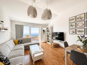 a living room with a couch and a table at Apartment Iris in Dubrovnik