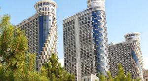 two tall buildings with trees in front of them at Gio apartment in Angisa +2 photos