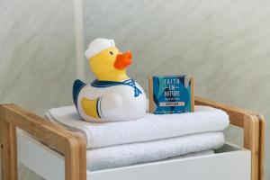 a rubber duck sitting on top of a pile of towels at 2 Bed in St. Ives oc-p00693 in Carbis Bay +13 photos