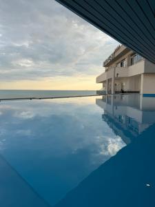 a swimming pool with a view of the ocean at Sky rooftop luxury suites in Durrës