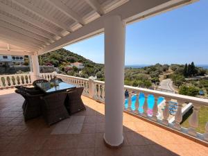 a balcony with a view of the ocean at Villa Karras in Pythagoreio
