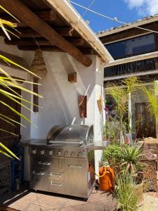 a grill on the patio of a house at La Guzmana de Ronda in Ronda