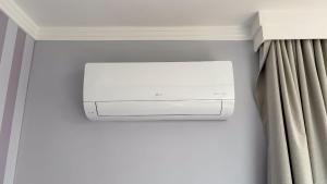 a air conditioner in the corner of a room at SHB - Central Miramar Shopping Mall from the beach in Santos