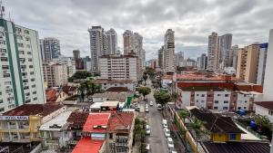 a city with buildings and cars on a street at SHB - Central Miramar Shopping Mall from the beach in Santos