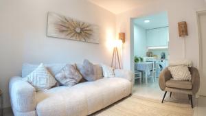 a living room with a couch and a chair at Stone House Perast in Kotor