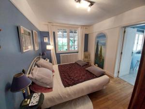 a bedroom with a large bed in a room at La Chesnaie in Bonnes +47 photos