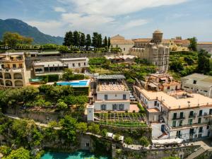 an aerial view of a town with a river and buildings at Residence Le Villette in Ravello
