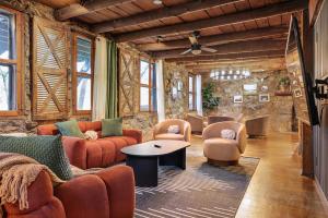 a living room with couches and chairs and a table at Wildrest Hotel in Waynesville