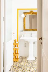 a bathroom with a sink and a mirror at B&B Faraglione in Lipari +57 photos