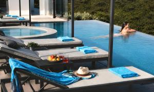 a woman in the swimming pool at a resort at Mistral Suite Heated Pool in Georgioupoli