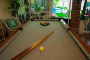 a snooker table with a ball in the middle at Private Villa in Guadalajara with heated Swimming Pool in San Agustín
