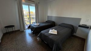 En eller flere senge i et værelse på Hotel Picasso