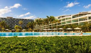 a hotel with a swimming pool and a resort at Aria Ocean in Nuevo Vallarta +30 photos