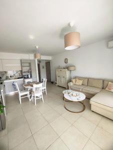 a living room with a couch and a table at Luxury Suite Gala in Nikiti