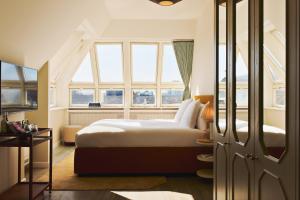 a bedroom with a bed and a window at Coco Hotel in Copenhagen