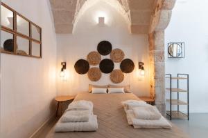 a bedroom with a large bed with two pillows at Gente di Mare Luxury Home in Fasano +47 photos