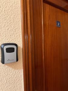 a toaster on the wall next to a door at Casa Noël in Puertollano