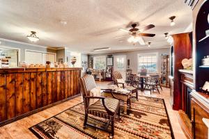 a large living room with chairs and a table at Deerfield Inn - Virtual Check In in Hayesville