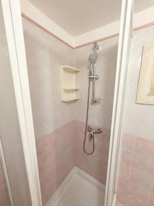 a shower stall in a bathroom with a shower at Libeccio House in Avola