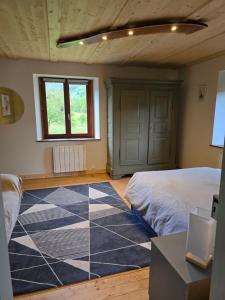 a bedroom with a blue and white tiled floor at Echappée Verte in Breitenbach-Haut-Rhin +28 photos