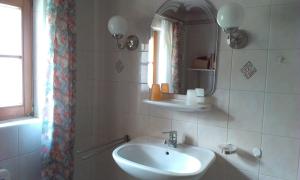 a bathroom with a sink and a mirror at Ferienhaus Goldegg 1 in Artstetten