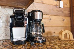 a coffee maker sitting on top of a counter at Chalet #57 in Stevensville +36 photos