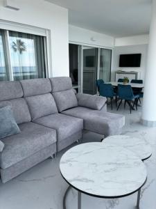 a living room with a couch and a table at Mi Capricho in Mijas Costa