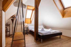 Llit o llits en una habitació de Spatzennest 12 fotos més