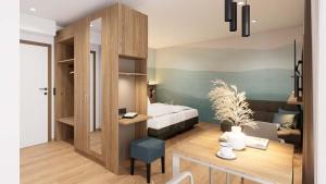 a living room with a bed and a desk in a room at Harabruck Apartments in Gmünd