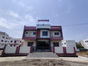 a building with a sign on top of it at Sai Samarth Residency Akkalkot in Akalkot