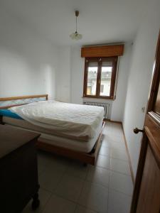 a bedroom with a bed and a window at Villa Carol in Polinago +13 photos