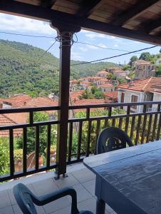 a balcony with a table and a view of a city at Deli House in Promírion