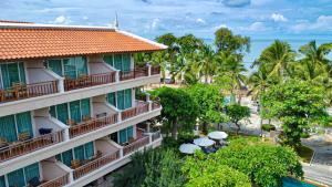 an aerial view of a hotel with palm trees and the ocean at Avalon Beach Resort Pattaya in Pattaya South