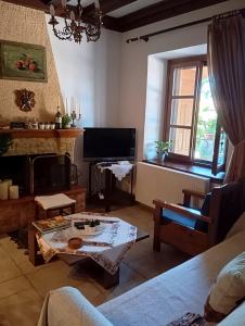 a living room with a couch and a table at Deli House in Promírion