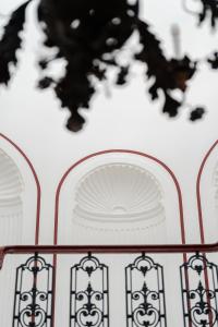 a close up of a table with a white and red table at Villa Helios Capri - Small Luxury Hotels of the World in Capri
