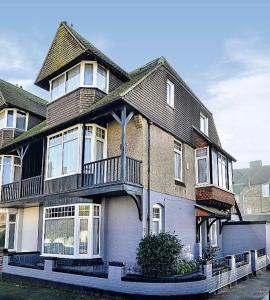 a large house with a balcony on a street at Ramsgate Corner Retreat in Ramsgate
