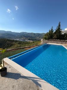 a swimming pool in a villa with a view at Filikuri Boutique Hotel in Himare