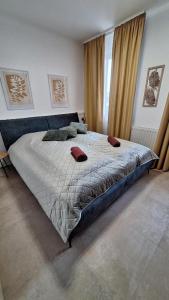a bedroom with a large bed and a window at Lavén Superior Apartment in Balatonfüred