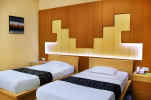 Lova arba lovos apgyvendinimo įstaigoje Hotel Permata Hijau Sukabumi