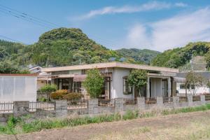 a house on the side of a road at 温泉街近くの一棟貸し ひだまり in Kirishima