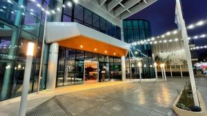 a large building with lights in front of it at Palmar Hotel Casino in Concordia