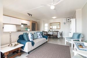 a living room with a couch and a table at Ballito Hills 478 in Ballito