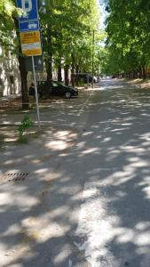 a street with a sign on the side of the road at Stan in Zrenjanin
