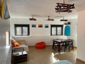 a living room with a couch and a table at Douro Surf Hostel in Vila Nova de Gaia