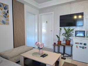 a living room with a couch and a table at Guesthouse Jelena in Višegrad