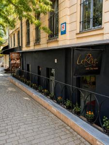 a building with flowers on the side of a street at Le Rêve city hostel in Odesa