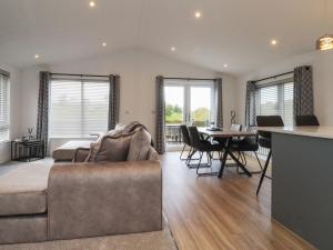 a living room with a couch and a table at Number 35 in Blackburn