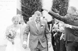 a bride and groom walking down the aisle at Sebber Kloster in Nibe