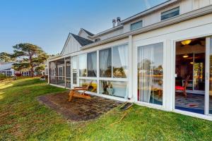a house with large sliding glass doors on a yard at Mallard Lakes 158 Cardinal Ln in Selbyville
